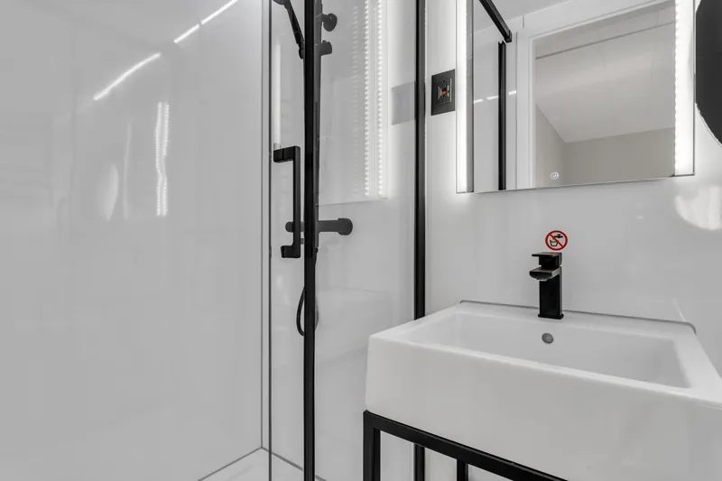 Slide: The Image of Modern bathroom in 2024 Waterlodge Apart EL with sleek shower and sink. - 8