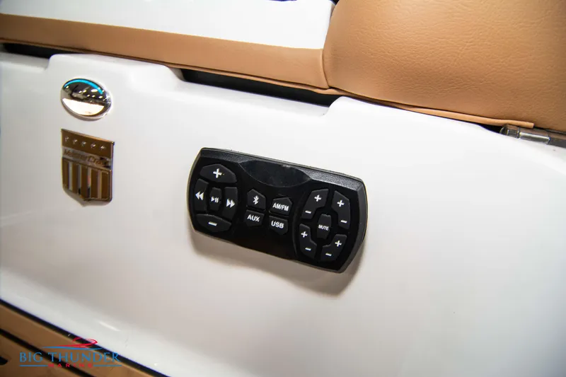 Slide: The Image of 2024 MasterCraft XT24 boat interior control panel with audio and navigation buttons. - 11