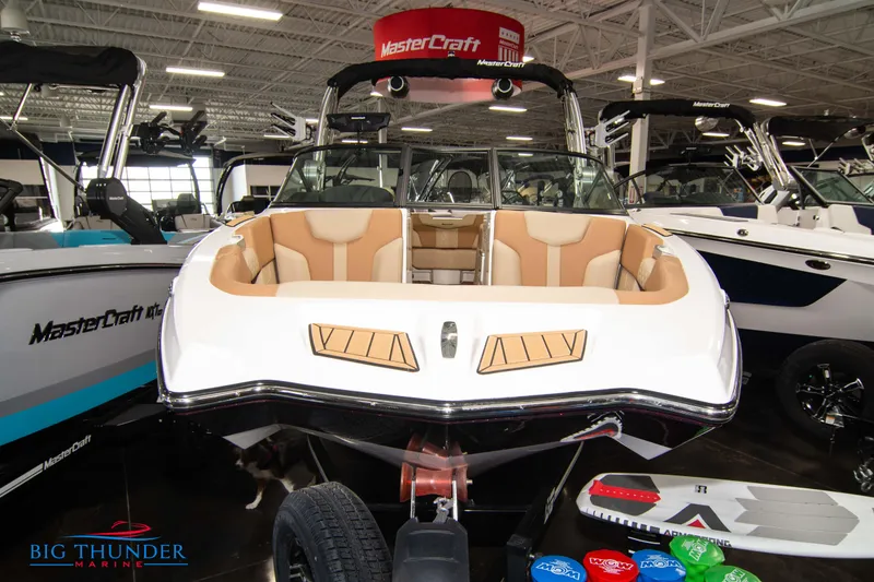 Slide: The Image of 2024 MasterCraft XT24 boat on display at Big Thunder Marine showroom. - 2