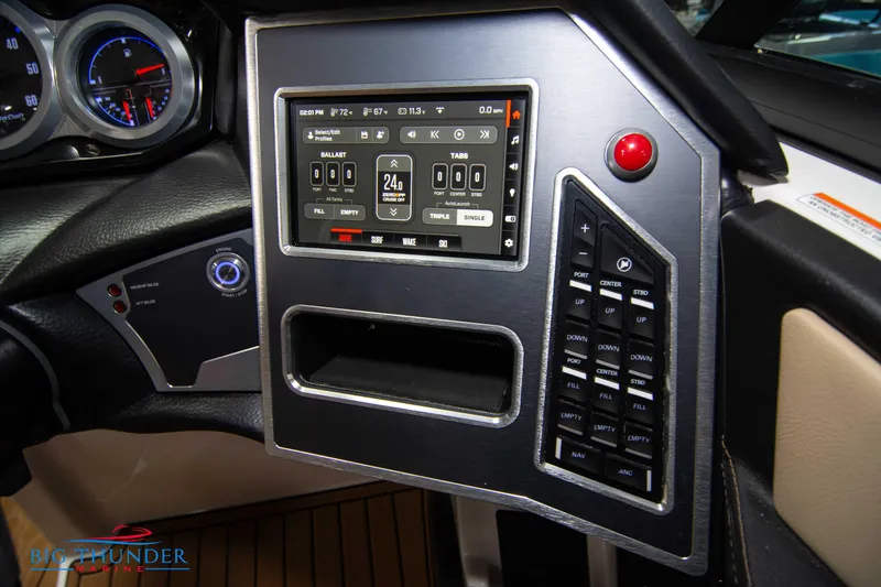 Slide: The Image of 2024 MasterCraft XT24 boat dashboard with touchscreen controls and gauges. - 32