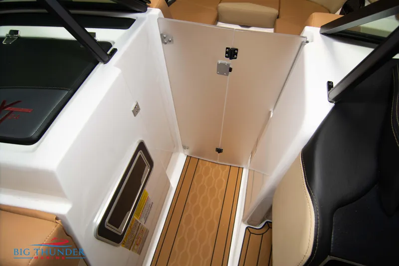 Slide: The Image of Interior view of 2024 MasterCraft XT24 boat with tan and black seating. - 40
