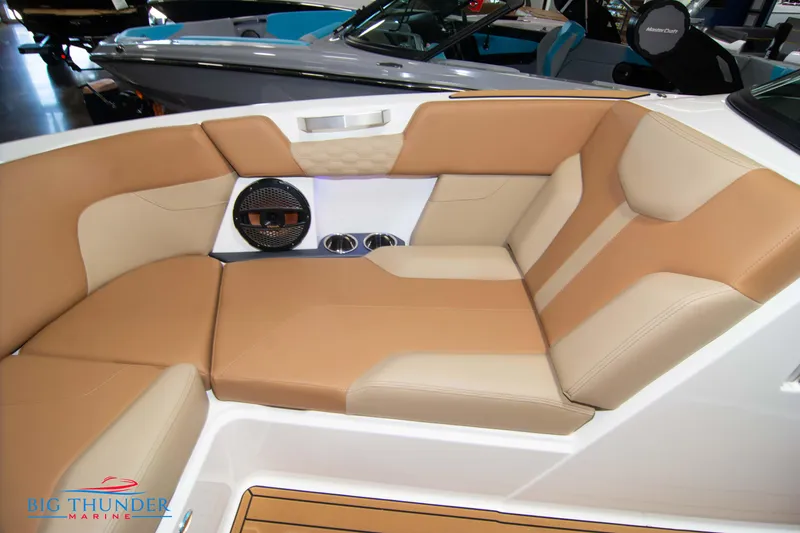 Slide: The Image of 2024 MasterCraft XT24 boat interior with tan and beige seating. - 42