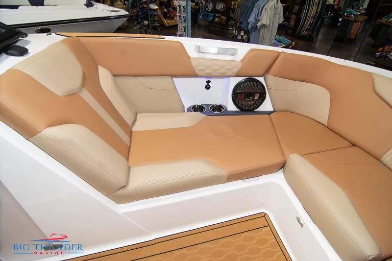 Slide: The Image of 2024 MasterCraft XT24 boat interior with tan and beige seating. - 43