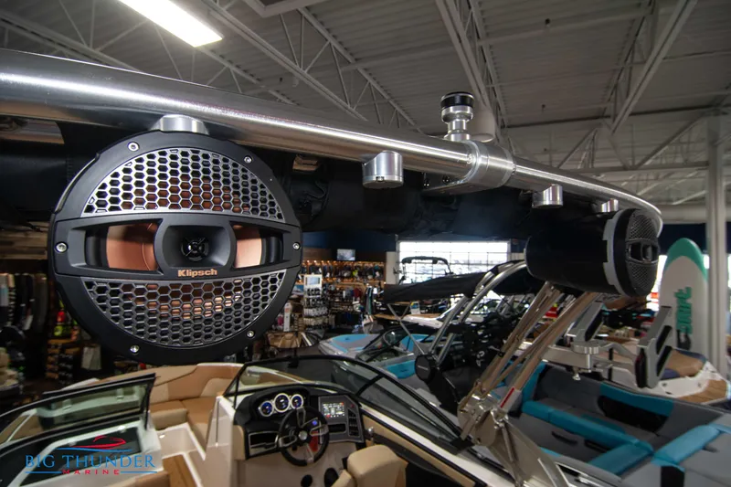 Slide: The Image of 2024 MasterCraft XT24 boat interior with Klipsch speakers and advanced dashboard. - 44