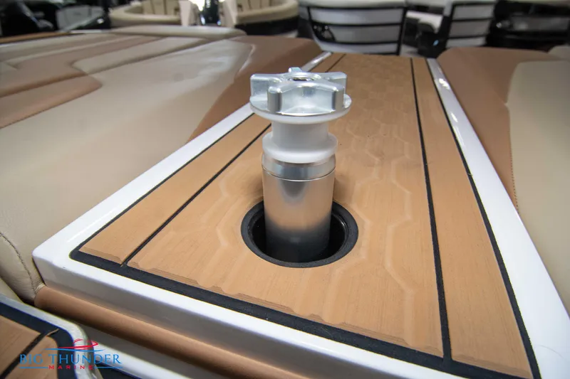 Slide: The Image of 2024 MasterCraft XT24 boat interior with teak flooring and a metal fixture. - 48