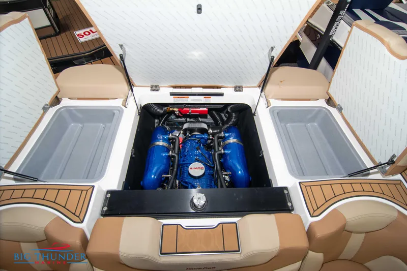 Slide: The Image of 2024 MasterCraft XT24 boat engine compartment with Ilmor engine. - 49