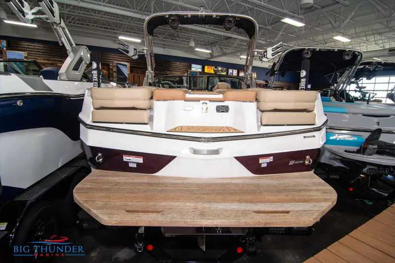 Slide: The Image of 2024 MasterCraft XT24 boat rear view in showroom. - 5