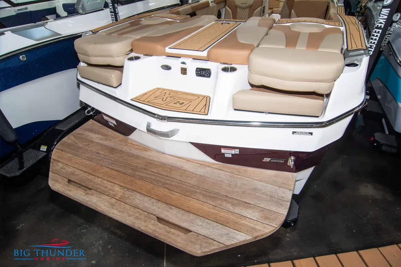 Slide: The Image of 2024 MasterCraft XT24 boat rear view with swim platform and seating. - 8