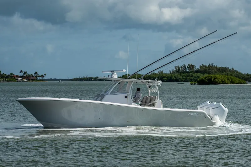 Slide: The Image of 2021 Front Runner 36 Center Console boat cruising on a calm waterway. - 1