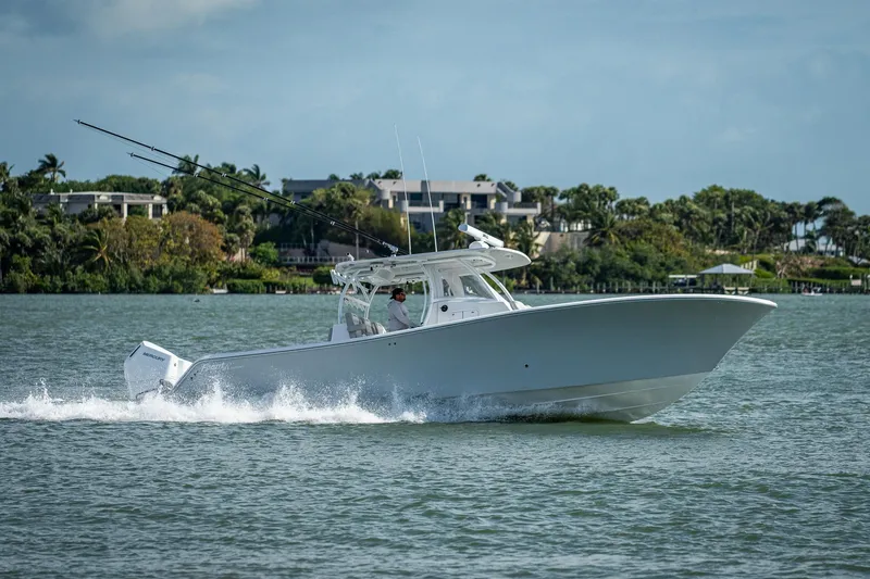 Slide: The Image of 2021 Front Runner 36 Center Console boat cruising on a lake. - 24