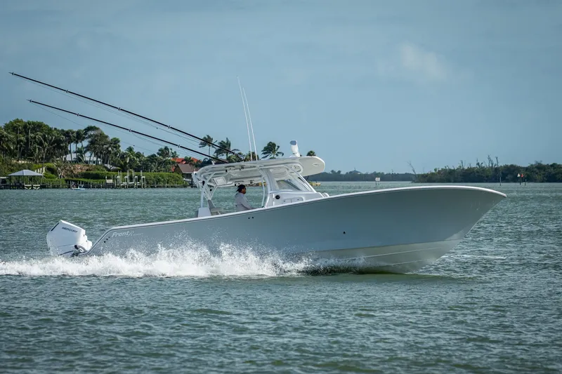 Slide: The Image of 2021 Front Runner 36 Center Console boat cruising on water. - 25