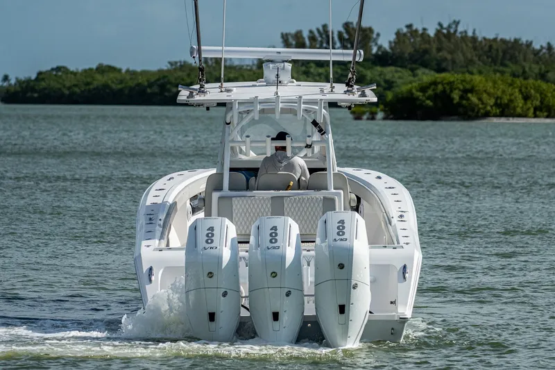 Slide: The Image of 2021 Front Runner 36 Center Console boat with triple 400 engines on water. - 3