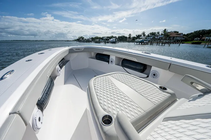 Slide: The Image of 2021 Front Runner 36 Center Console boat with luxurious seating on a sunny day. - 5