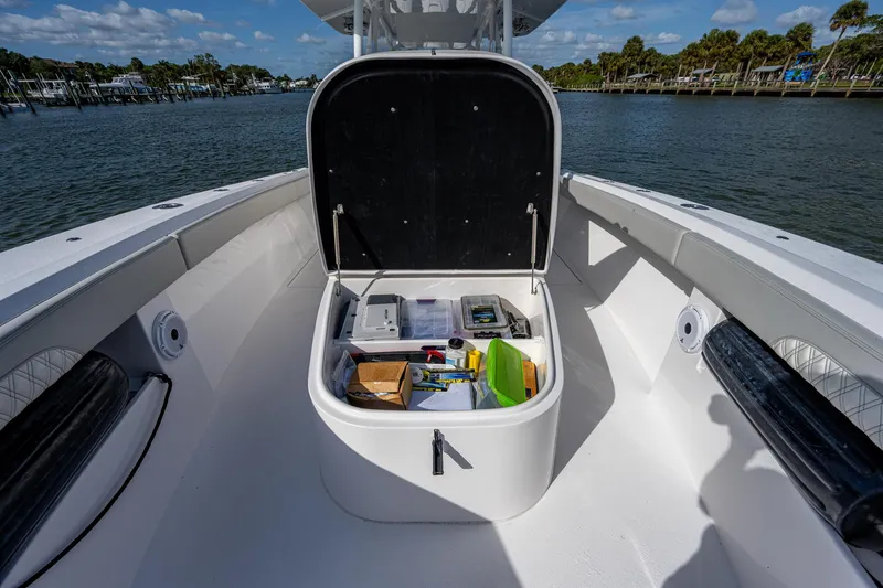 Slide: The Image of 2021 Front Runner 36 Center Console boat with open storage compartment on deck. - 8