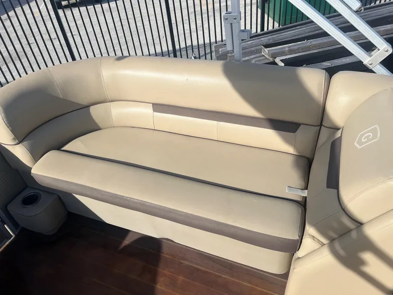 Slide: The Image of 2019 Godfrey Sweetwater 2286 boat seating, beige upholstery, outdoor setting. - 10