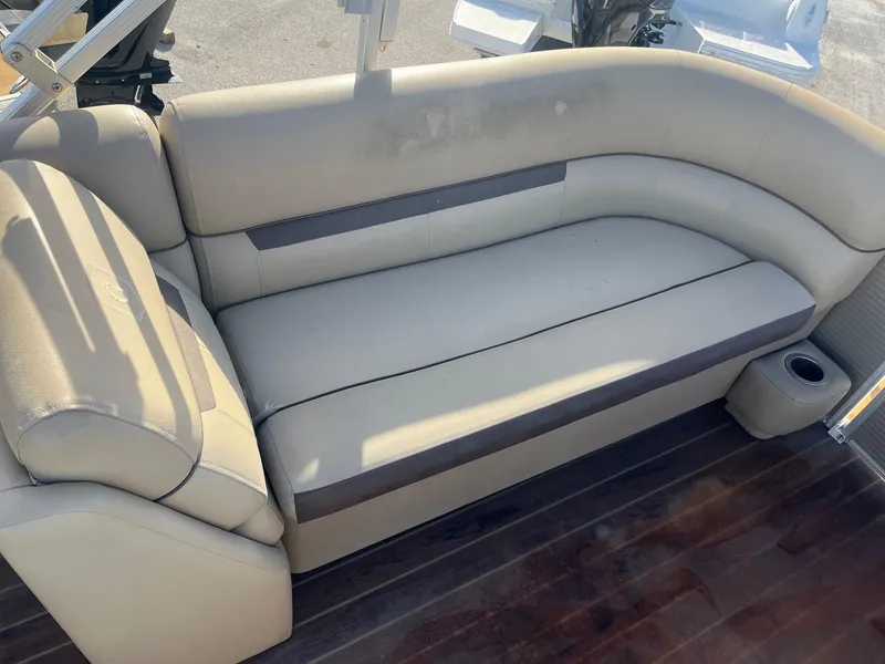 Slide: The Image of Beige seating on 2019 Godfrey Sweetwater 2286 boat with wooden flooring. - 11