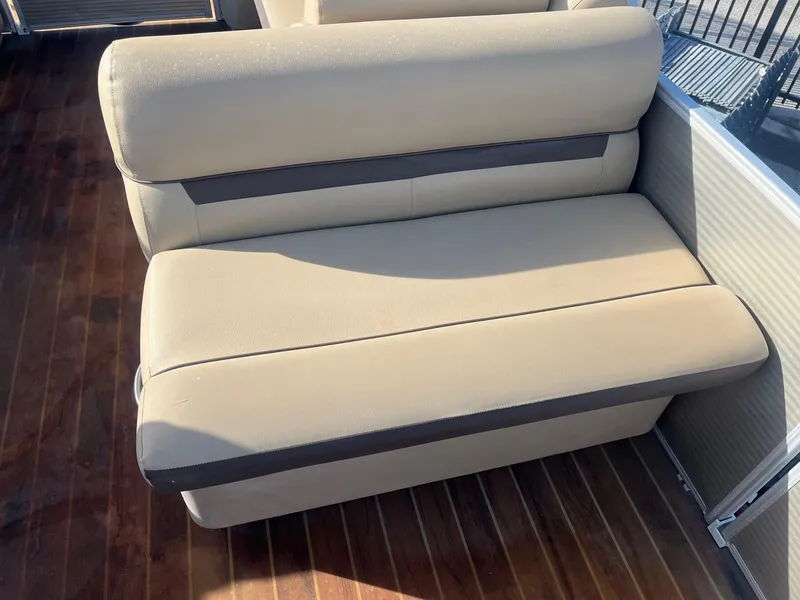 Slide: The Image of Beige seating on 2019 Godfrey Sweetwater 2286 boat with wooden flooring. - 12