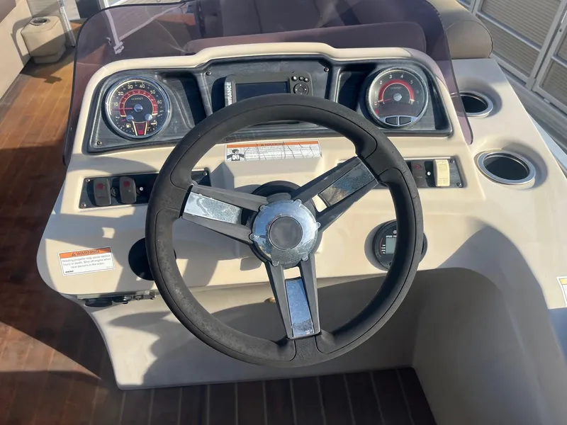 Slide: The Image of Steering console of 2019 Godfrey Sweetwater 2286 boat with gauges and controls. - 9