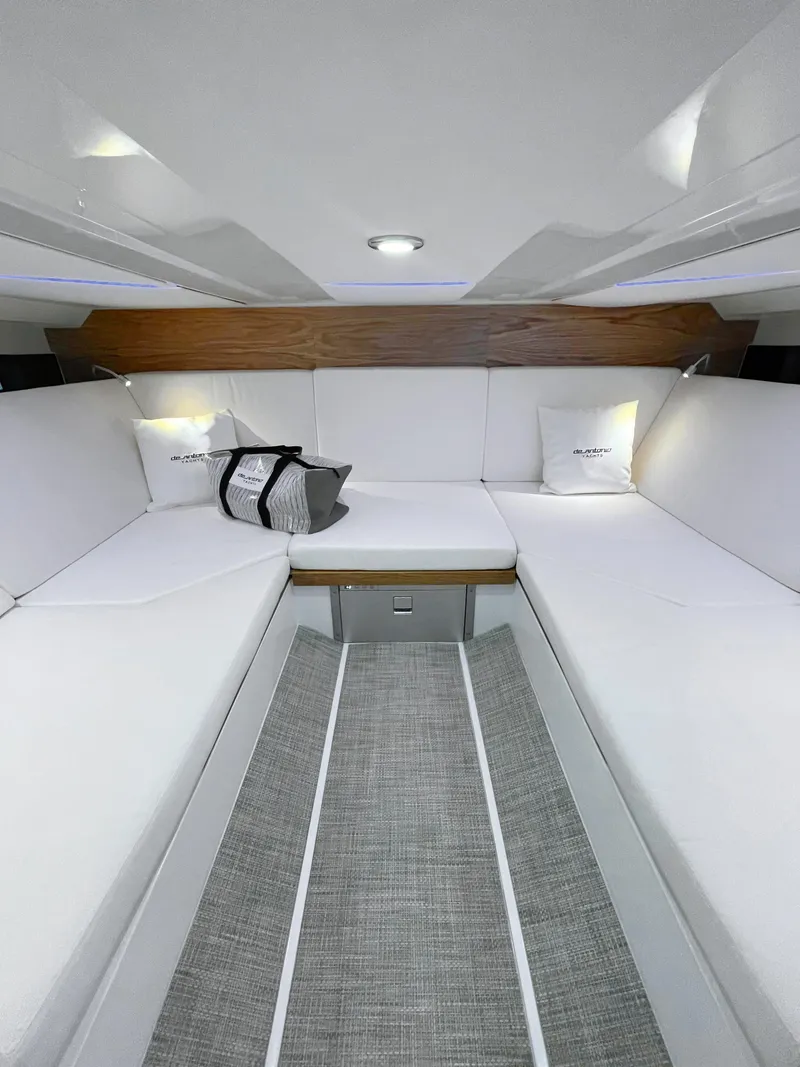 Slide: The Image of Interior of 2025 De Antonio Yachts D36 OPEN, featuring sleek white seating and modern design. - 13