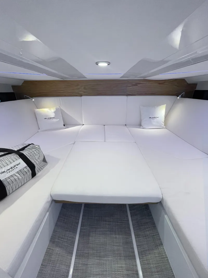 Slide: The Image of 2025 De Antonio Yachts D36 OPEN interior with white seating and modern design. - 14