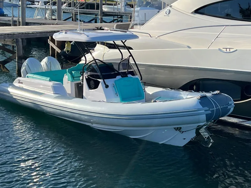 Slide: The Image of 2025 Ranieri CAYMAN 27.0 SPORT TOURING boat docked in marina. - 2