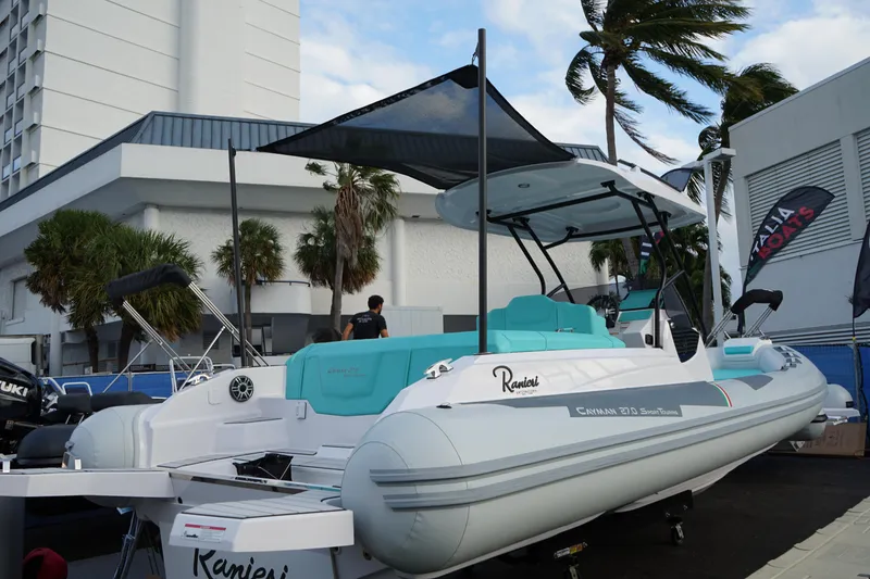 Slide: The Image of 2025 Ranieri CAYMAN 27.0 SPORT TOURING boat displayed outdoors. - 6