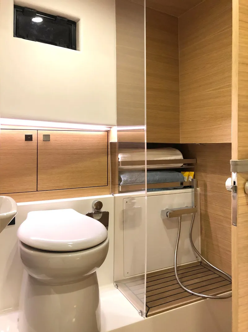 Slide: The Image of 2024 De Antonio Yachts D42 Open bathroom with modern fixtures and wooden accents. - 13