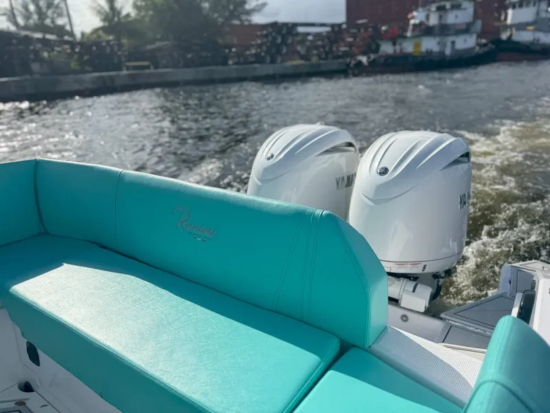 Slide: The Image of 2025 Ranieri CAYMAN 27.0 SPORT TOURING with twin Yamaha engines on a sunny day. - 28