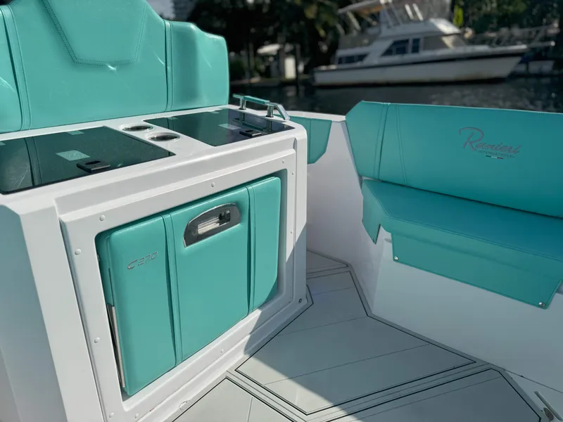 Slide: The Image of 2025 Ranieri CAYMAN 27.0 SPORT TOURING interior with turquoise seating and sleek design. - 27