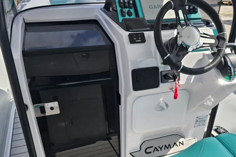 Slide: The Image of 2025 Ranieri CAYMAN 27.0 SPORT TOURING helm with Garmin navigation system and steering wheel. - 18