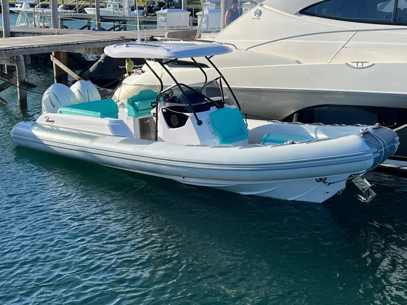 Slide: The Image of 2025 Ranieri CAYMAN 27.0 SPORT TOURING boat docked in marina. - 3