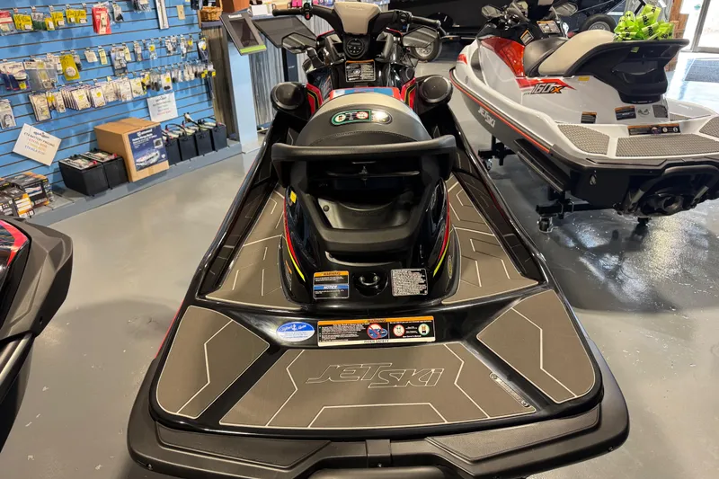 Slide: The Image of 2025 Kawasaki STX160LX jet ski displayed in a showroom with accessories. - 6