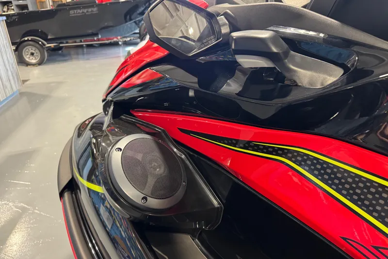 Slide: The Image of 2025 Kawasaki STX160LX jet ski with vibrant red and black design, featuring a built-in speaker. - 9