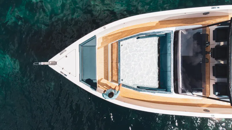Slide: The Image of Aerial view of 2024 De Antonio Yachts D50 OPEN on clear water. - 10