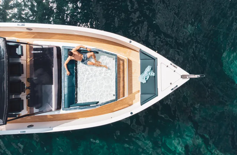 Slide: The Image of 2024 De Antonio Yachts D50 OPEN, aerial view, luxury yacht on clear blue water. - 8