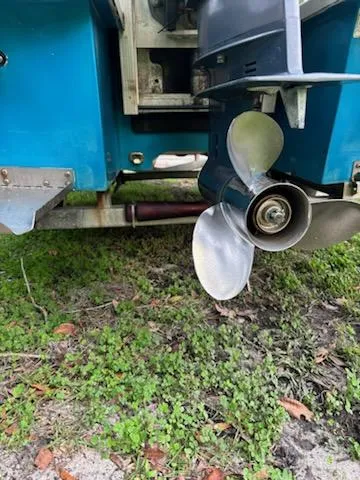 Slide: The Image of 2009 Hell's Bay WATERMAN boat propeller on grass. - 12