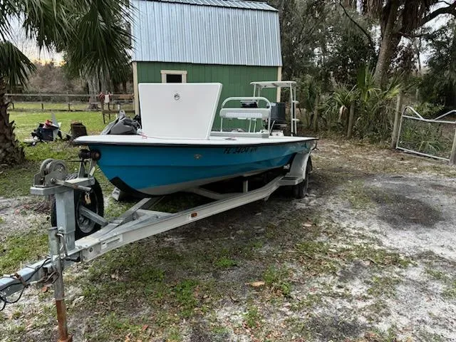 Slide: The Image of 2009 Hell's Bay WATERMAN boat on trailer in a rural setting. - 2