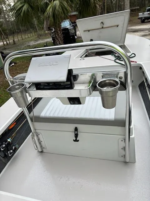 Slide: The Image of 2009 Hell's Bay WATERMAN boat console with cup holders and storage compartment. - 5