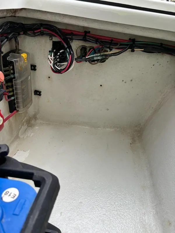 Slide: The Image of 2009 Hell's Bay WATERMAN boat wiring compartment with electrical components and cables. - 9