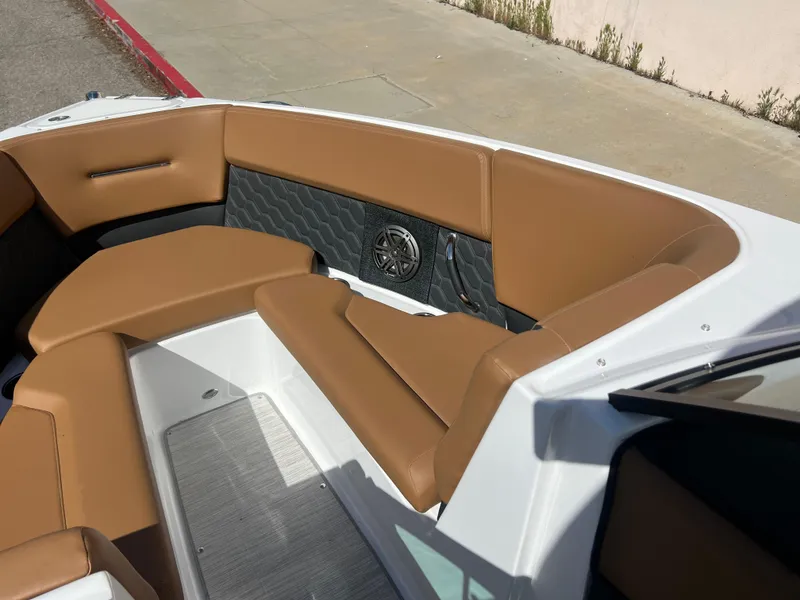 Slide: The Image of 2023 Four Winns H4 boat with tan leather seating and modern interior design. - 16