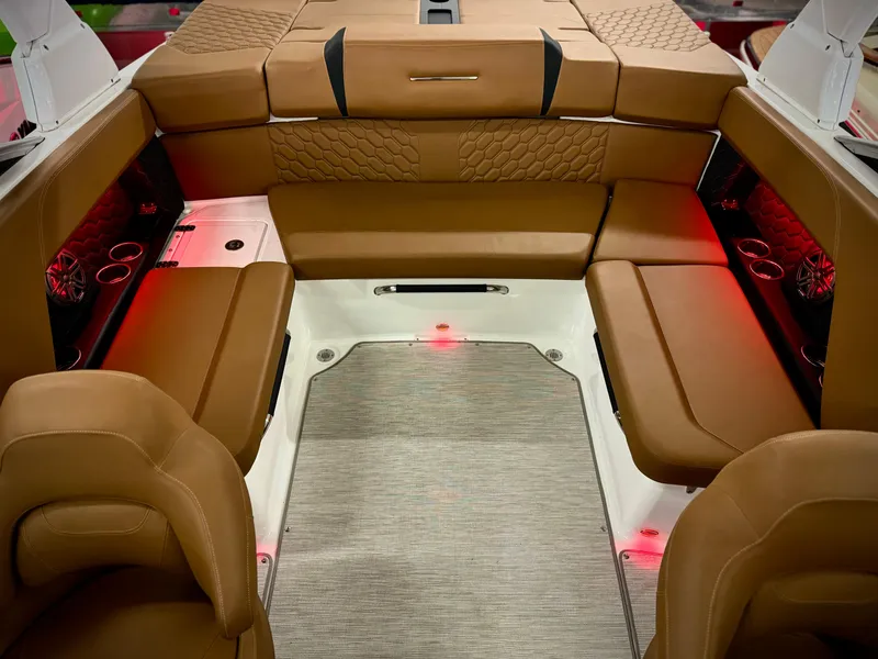 Slide: The Image of Luxurious interior of 2023 Four Winns H4 boat with brown leather seating and ambient lighting. - 33