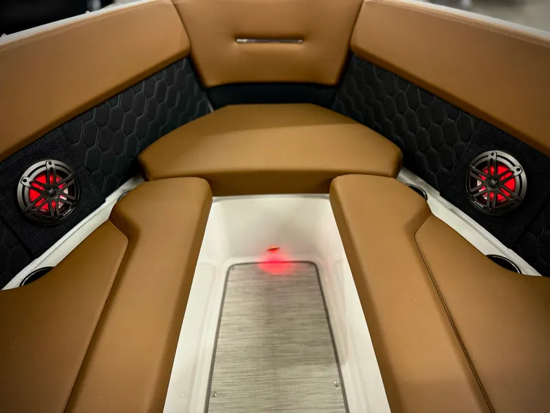 Slide: The Image of 2023 Four Winns H4 boat interior with brown seating and red speakers. - 37