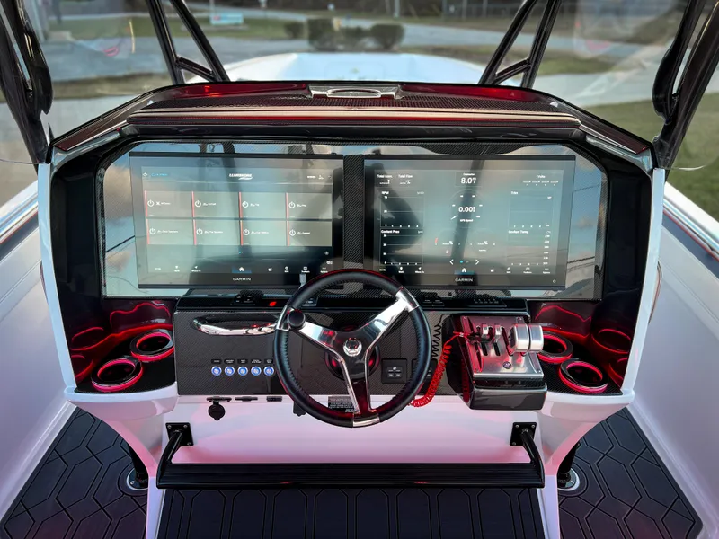 Slide: The Image of 2025 Nor-Tech 390 Sport boat dashboard with advanced digital controls and sleek design. - 15