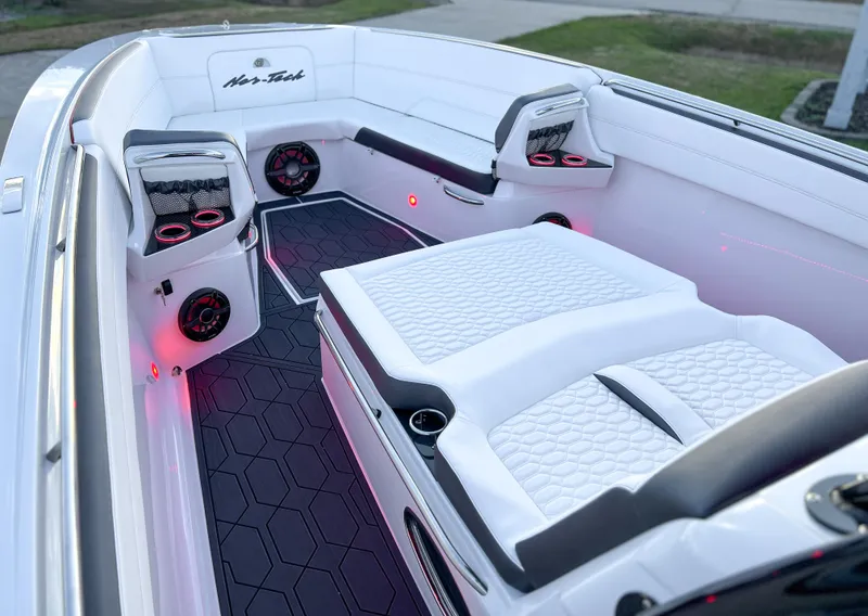 Slide: The Image of Luxurious interior of 2025 Nor-Tech 390 Sport boat with modern seating and ambient lighting. - 18
