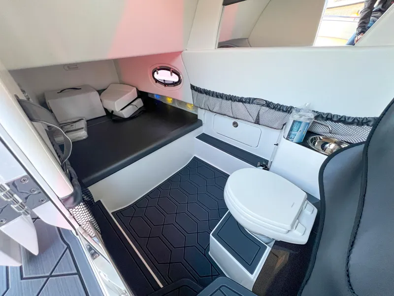 Slide: The Image of 2025 Nor-Tech 390 Sport cabin interior with modern amenities and sleek design. - 19