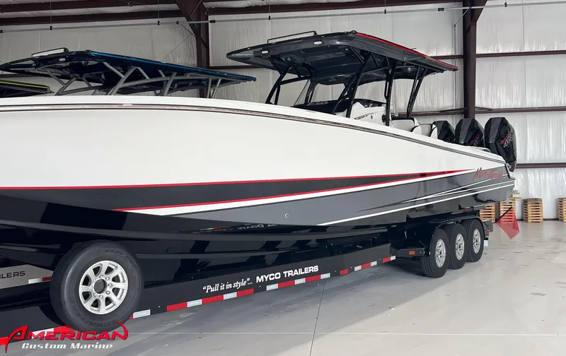 Slide: The Image of 2025 Nor-Tech 390 Sport boat on trailer in a warehouse. - 23