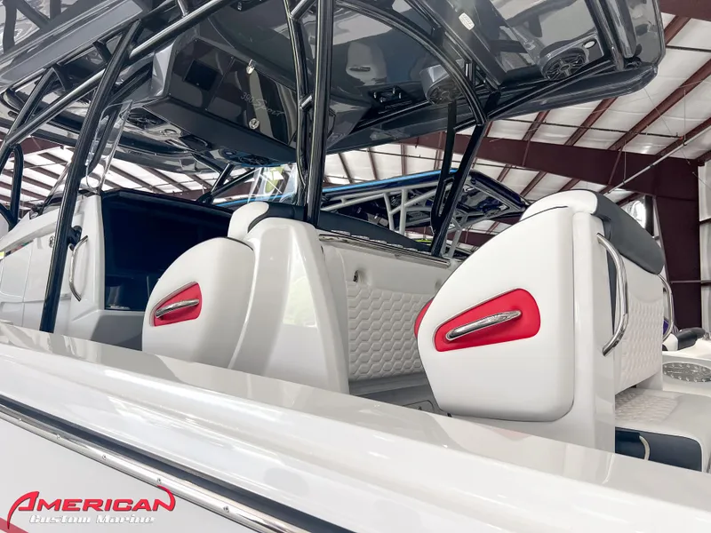 Slide: The Image of 2025 Nor-Tech 390 Sport boat interior with sleek white and red seating. - 27