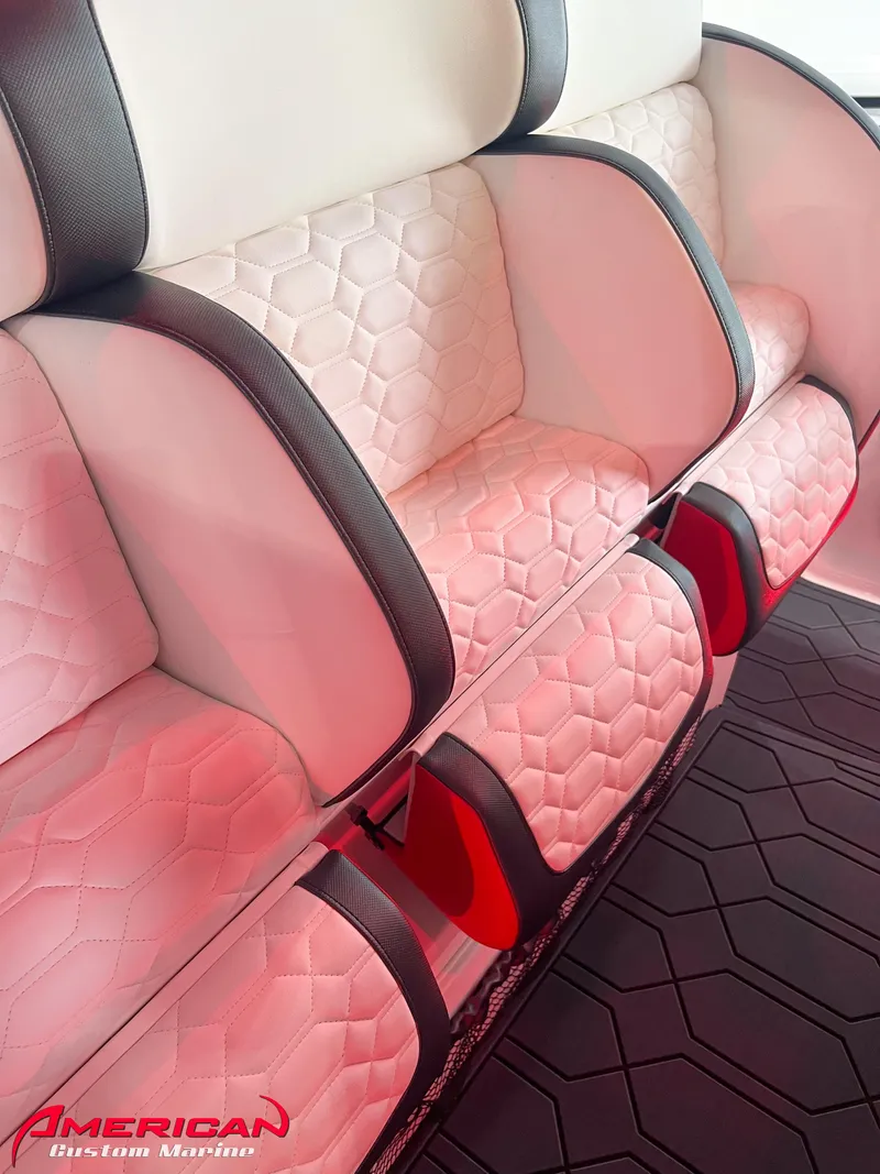 Slide: The Image of Luxurious interior seating of 2025 Nor-Tech 390 Sport boat with custom upholstery. - 29