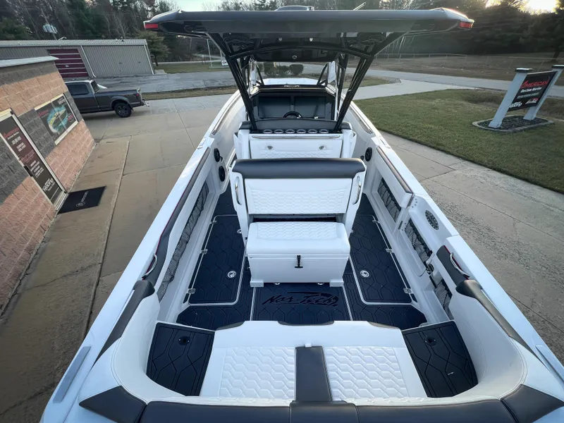 Slide: The Image of 2025 Nor-Tech 390 Sport boat interior with sleek seating and modern design. - 6