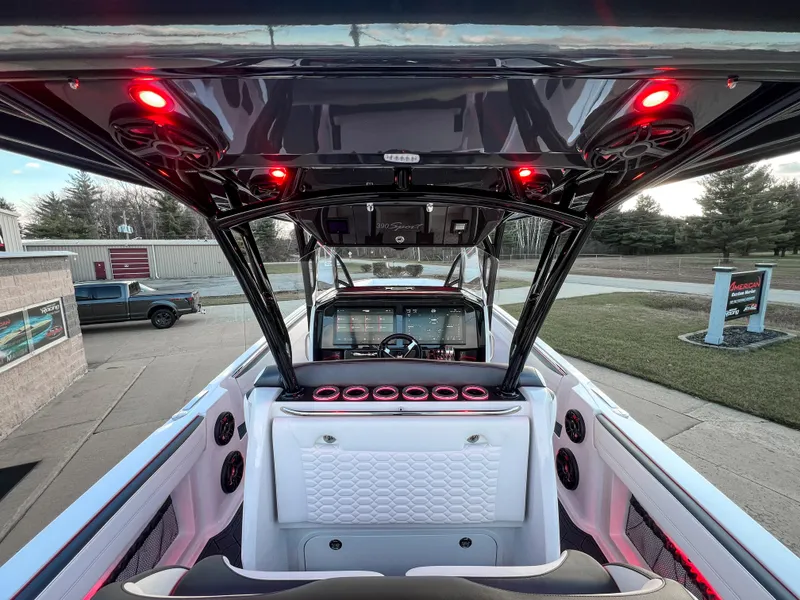 Slide: The Image of 2025 Nor-Tech 390 Sport boat interior with red LED lights and modern dashboard. - 7